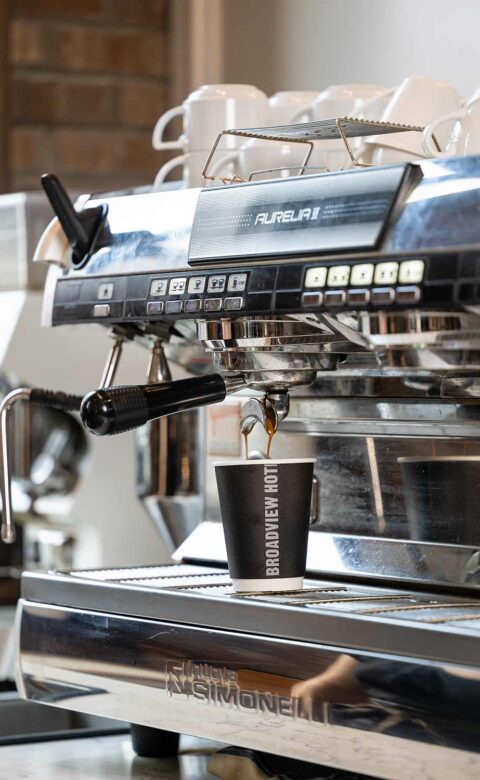 coffee maker with black broadview hotel cup