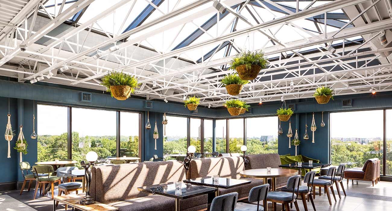 dining room with blue walls chairs and large sunroof