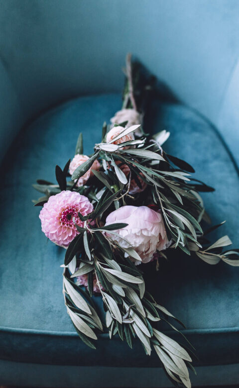flowers laying on blue chair
