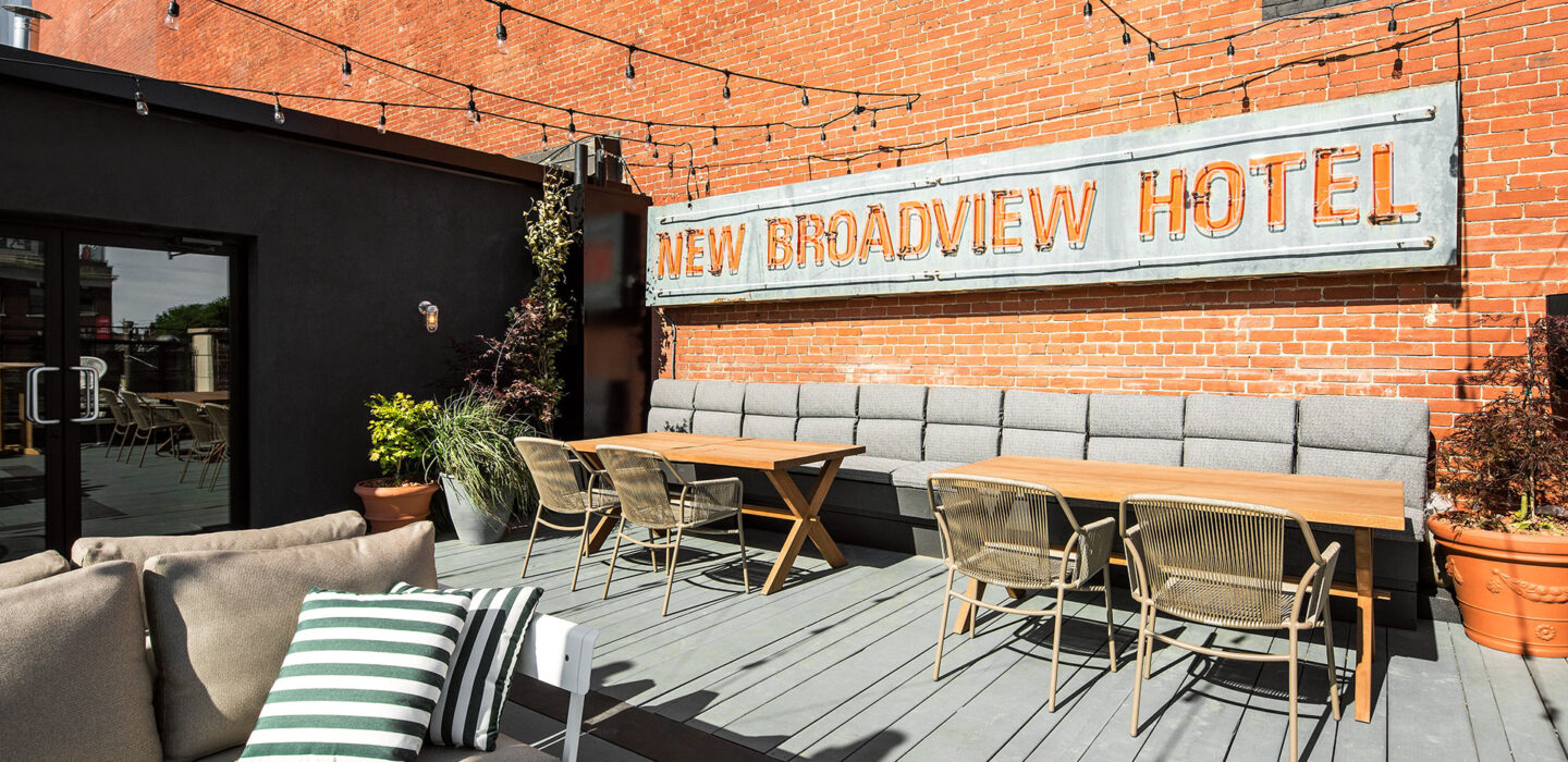rooftop seating area with seating and new broadview hotel sign
