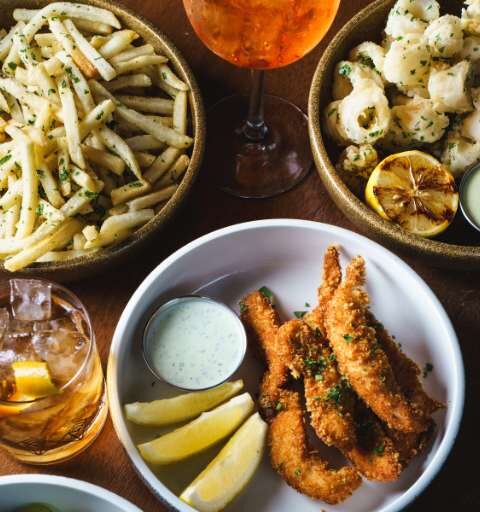 bowls of food and glasses of drinks on a table