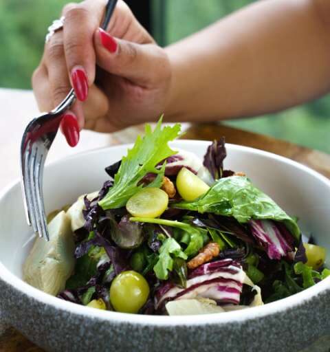 a woman eating a salad